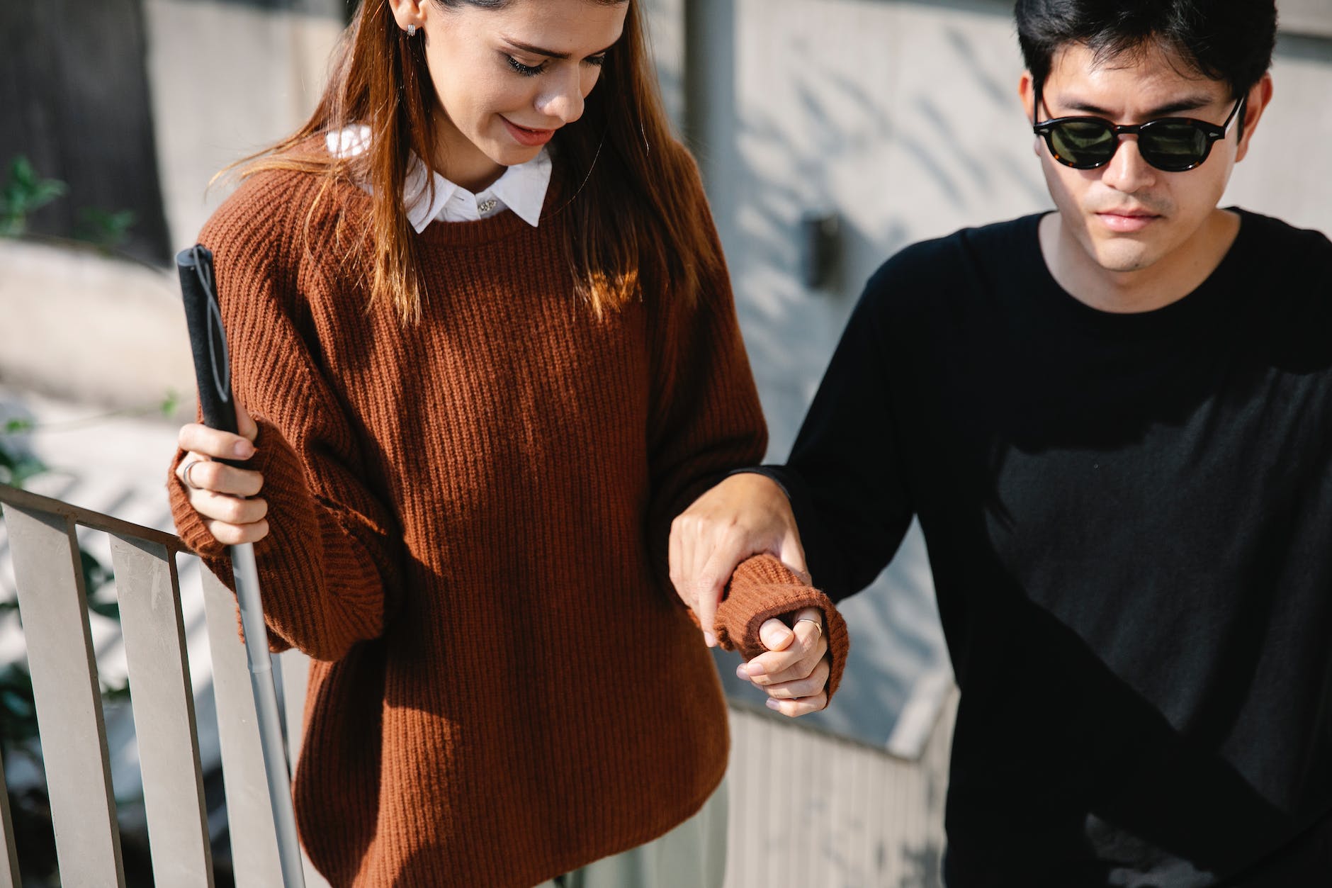 photo of man holding to woman s arm